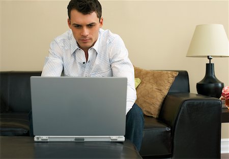 simsearch:600-00909605,k - Man Using Laptop Computer Stock Photo - Premium Royalty-Free, Code: 600-00909589