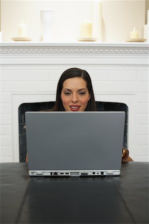fireplace computer - Woman Using Laptop Computer Stock Photo - Premium Royalty-Free, Code: 600-00909605
