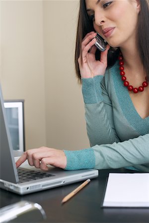 Woman Talking on Cell Phone and Using Laptop Stock Photo - Premium Royalty-Free, Code: 600-00909639