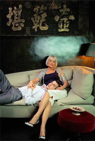 fifty years old blonde - Couple on Sofa Stock Photo - Premium Royalty-Free, Code: 600-00909839