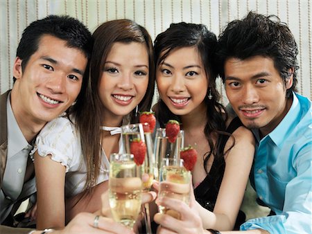 Portrait of Group with Champagne And Strawberries Stock Photo - Premium Royalty-Free, Code: 600-00909884