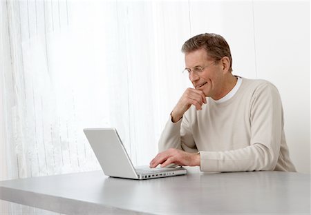 Man Using Laptop Stock Photo - Premium Royalty-Free, Code: 600-00909983