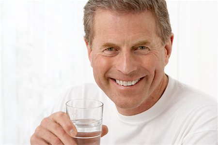 simsearch:693-03305464,k - Portrait of Man With Glass of Water Stock Photo - Premium Royalty-Free, Code: 600-00917015