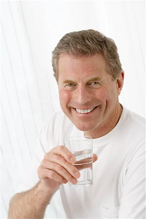 simsearch:693-03305464,k - Portrait of Man With Glass of Water Stock Photo - Premium Royalty-Free, Code: 600-00917017
