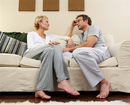 disagreement candid - Couple Talking on Sofa Stock Photo - Premium Royalty-Free, Code: 600-00917111