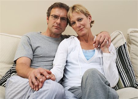 Portrait of Couple on Sofa Stock Photo - Premium Royalty-Free, Code: 600-00917121