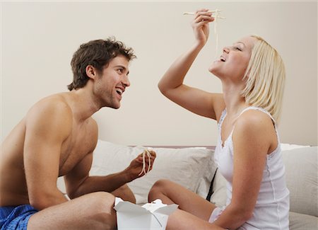 simsearch:600-00954751,k - Couple Eating Chinese Food in Bed Stock Photo - Premium Royalty-Free, Code: 600-00917200