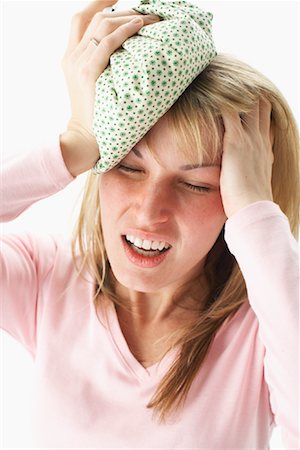 sick ice pack - Woman with Headache Stock Photo - Premium Royalty-Free, Code: 600-00917286