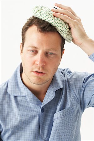 Man with Headache Fotografie stock - Premium Royalty-Free, Codice: 600-00917321