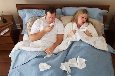 female coughing - Sick Couple in Bed Stock Photo - Premium Royalty-Free, Code: 600-00917352