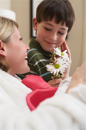 Son Giving Mother Flowers Stock Photo - Premium Royalty-Free, Code: 600-00917369