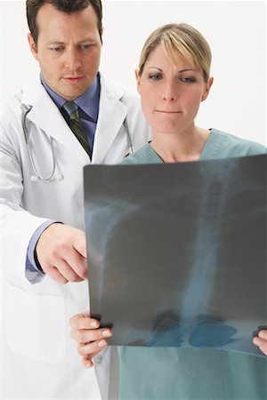 doctor looking at xray - Portrait of Doctors Looking at X-Ray Stock Photo - Premium Royalty-Free, Code: 600-00917401