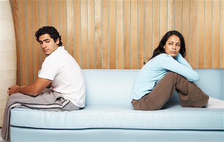 Couple Sitting With Backs to Each Other Stock Photo - Premium Royalty-Free, Code: 600-00917482