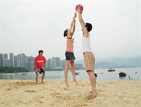 people playing volleyball on the beach - People Playing on the Beach Stock Photo - Premium Royalty-Free, Code: 600-00910388