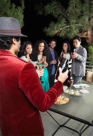 Man Holding Martini Shaker at Party Stock Photo - Premium Royalty-Free, Code: 600-00910578