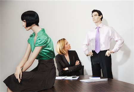 fake businessman - Businesswoman Surrounded By Mannequins Stock Photo - Premium Royalty-Free, Code: 600-00912174