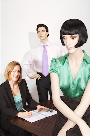 simsearch:614-06974867,k - Businesswoman Surrounded By Mannequins Stock Photo - Premium Royalty-Free, Code: 600-00912176