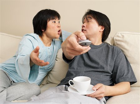 Couple Sitting on Sofa Stock Photo - Premium Royalty-Free, Code: 600-00934062