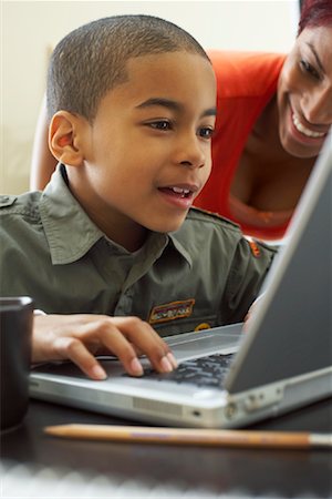 Boy Using Laptop Computer Stock Photo - Premium Royalty-Free, Code: 600-00934328