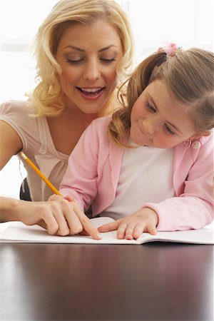 simsearch:600-00947952,k - Mother Helping Daughter with Homework Stock Photo - Premium Royalty-Free, Code: 600-00934429