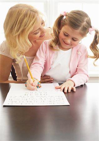 simsearch:600-00947952,k - Mother Helping Daughter with Homework Stock Photo - Premium Royalty-Free, Code: 600-00934430