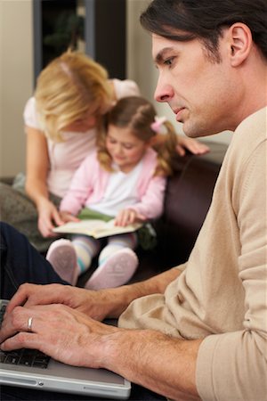 simsearch:600-00934396,k - Family in Living Room Stock Photo - Premium Royalty-Free, Code: 600-00934447