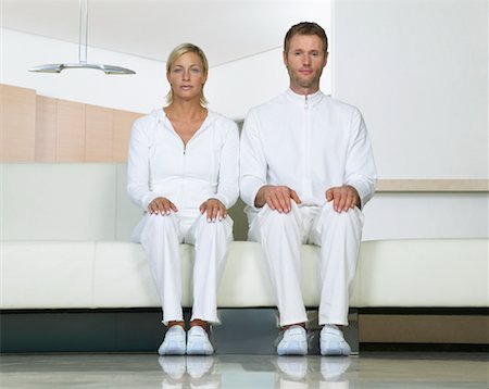 futuristic athletic wear - Portrait of Couple Sitting on Sofa Stock Photo - Premium Royalty-Free, Code: 600-00934680