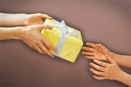 Hands Giving Gift Stock Photo - Premium Royalty-Free, Code: 600-00934755