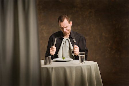 Man Sitting at Table Foto de stock - Sin royalties Premium, Código: 600-00947816