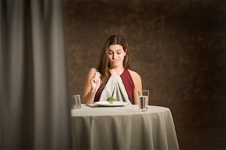 Woman Sitting at Table Stock Photo - Premium Royalty-Free, Code: 600-00947817