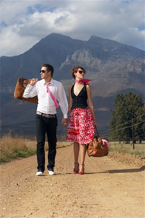 fashion model in skirt - Couple Walking Down Country Road Stock Photo - Premium Royalty-Free, Code: 600-00948072