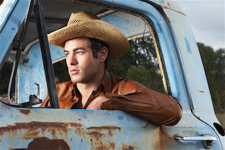 pick up truck portraits - Man In Cowboy Hat and Rusty Truck Stock Photo - Premium Royalty-Free, Code: 600-00948090