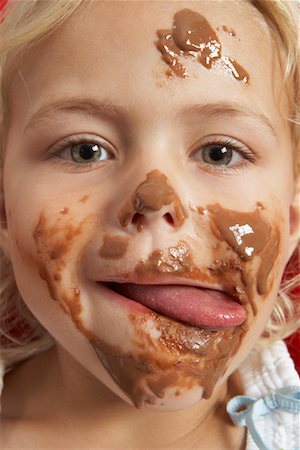 Girl with Chocolate on Face Stock Photo - Premium Royalty-Free, Code: 600-00948150