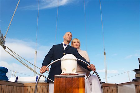 senior couple looking ahead - Couple on Boat Stock Photo - Premium Royalty-Free, Code: 600-00948205