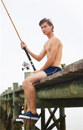 Man Holding Fishing Rod Stock Photo - Premium Royalty-Free, Code: 600-00948209