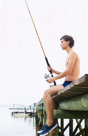 simsearch:600-00955470,k - Man Holding Fishing Rod Fotografie stock - Premium Royalty-Free, Codice: 600-00948211