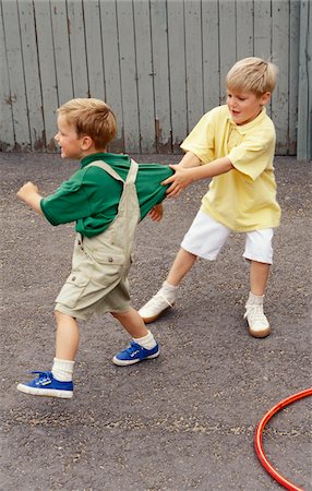 Boys Fighting Outdoors Stock Photo - Premium Royalty-Free, Code: 600-00948328