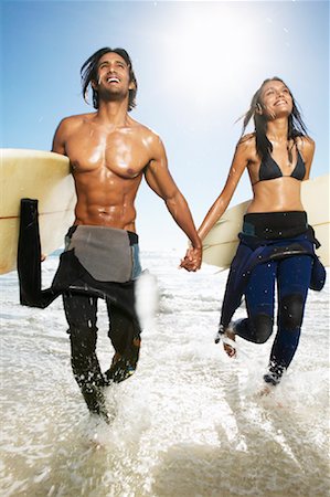 Couple with Surfboards at Beach Stock Photo - Premium Royalty-Free, Code: 600-00948465