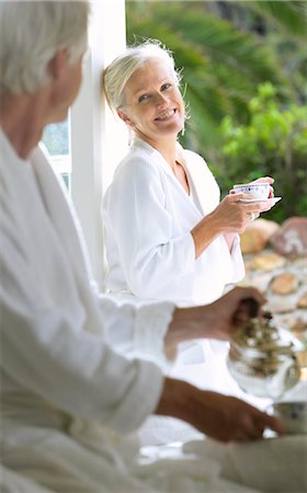 Couple Drinking Morning Coffee On Terrace Stock Photo - Premium Royalty-Free, Code: 600-00948551