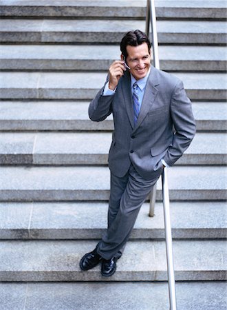 Portrait of Businessman Using Cellular Telephone Foto de stock - Sin royalties Premium, Código: 600-00948940