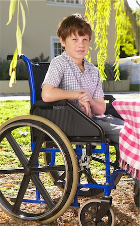 Portrait of Boy in Wheelchair Stock Photo - Premium Royalty-Free, Code: 600-00949012