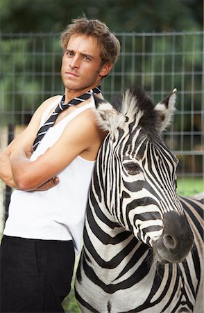 Man with Zebra Stock Photo - Premium Royalty-Free, Code: 600-00949070