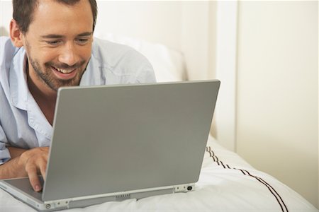 Man Using Laptop Computer Stock Photo - Premium Royalty-Free, Code: 600-00949085