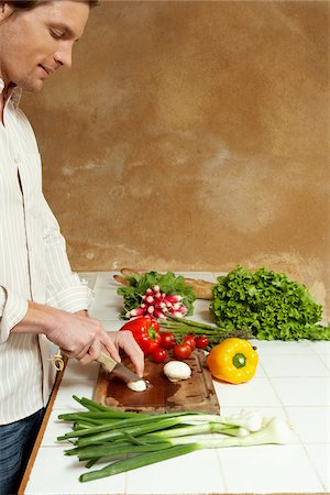 Man Chopping Vegetables Stock Photo - Premium Royalty-Free, Code: 600-00954738