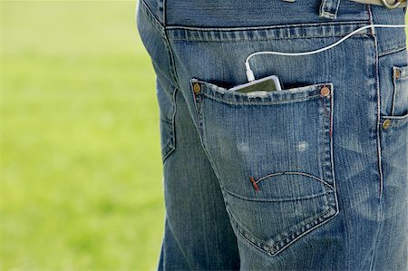 simsearch:700-01196071,k - Mp3 Player in Man's Back Pocket Stock Photo - Premium Royalty-Free, Code: 600-00954830