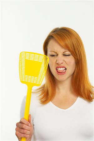 Woman Holding Fly Swatter Stock Photo - Premium Royalty-Free, Code: 600-00955310