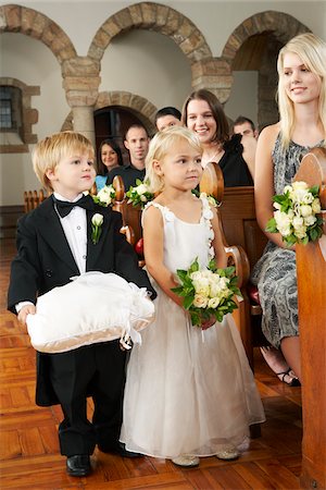 sitting in pews - Ringbearer and Flowergirl at Wedding Stock Photo - Premium Royalty-Free, Code: 600-00955433