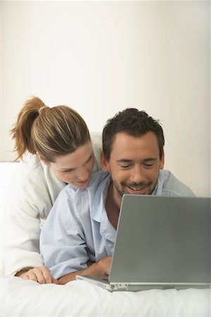Couple in Bed, Using Laptop Stock Photo - Premium Royalty-Free, Code: 600-00955605