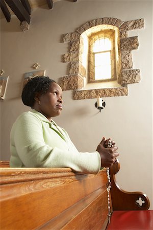 ethnic people in church pews - Woman Praying Stock Photo - Premium Royalty-Free, Code: 600-00984084