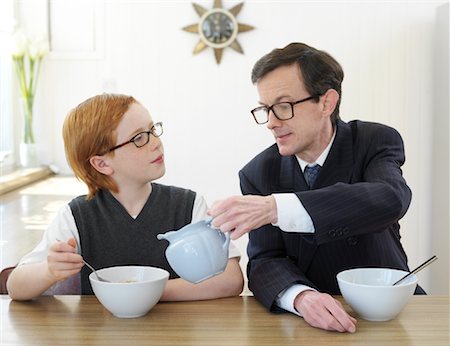 pictures of kids helping parents with dishes - Father and Son Eating Breakfast Stock Photo - Premium Royalty-Free, Code: 600-00984148